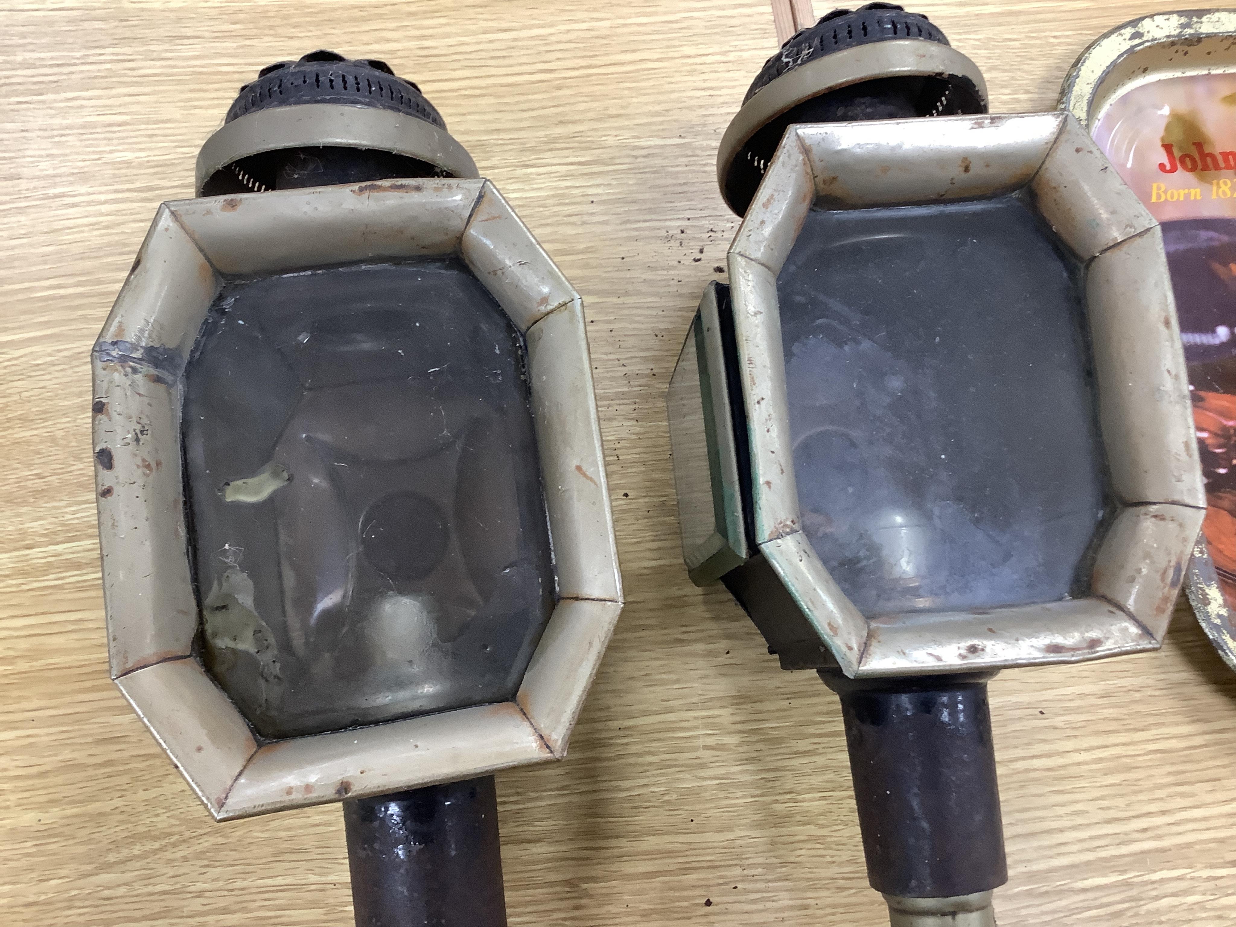 A pair of late 19th century carriage lamps and another